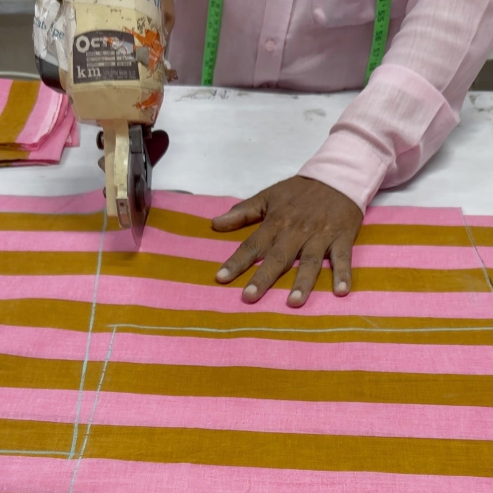 Fabric being cut in the Parag Artex workshop