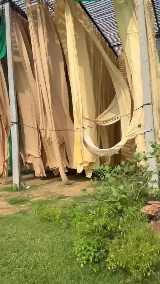 Lengths of fabric hanging outdoors